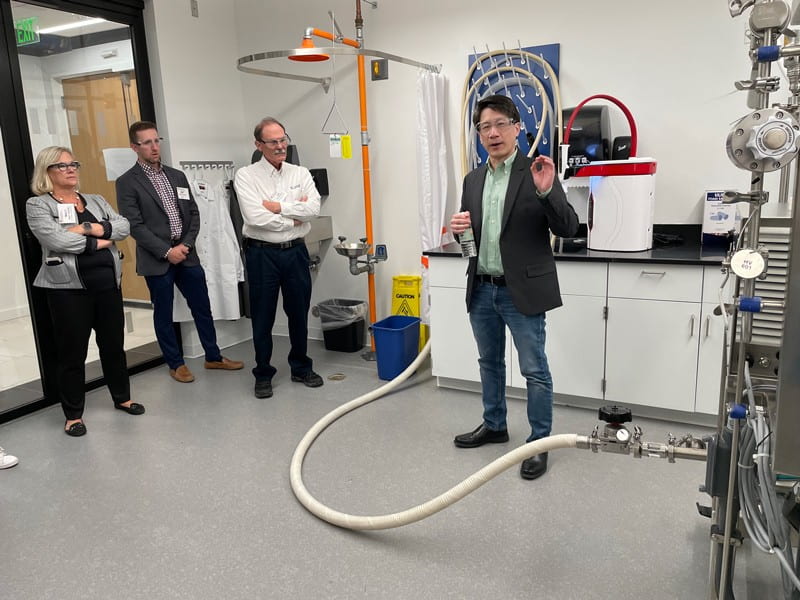 Kelvin Lee, UD’s interim vice president for research, scholarship and innovation, founding director of NIIMBL, and Gore Professor of Chemical and Biomolecular Engineering at UD, guides visitors on a tour of facilities on STAR Campus.